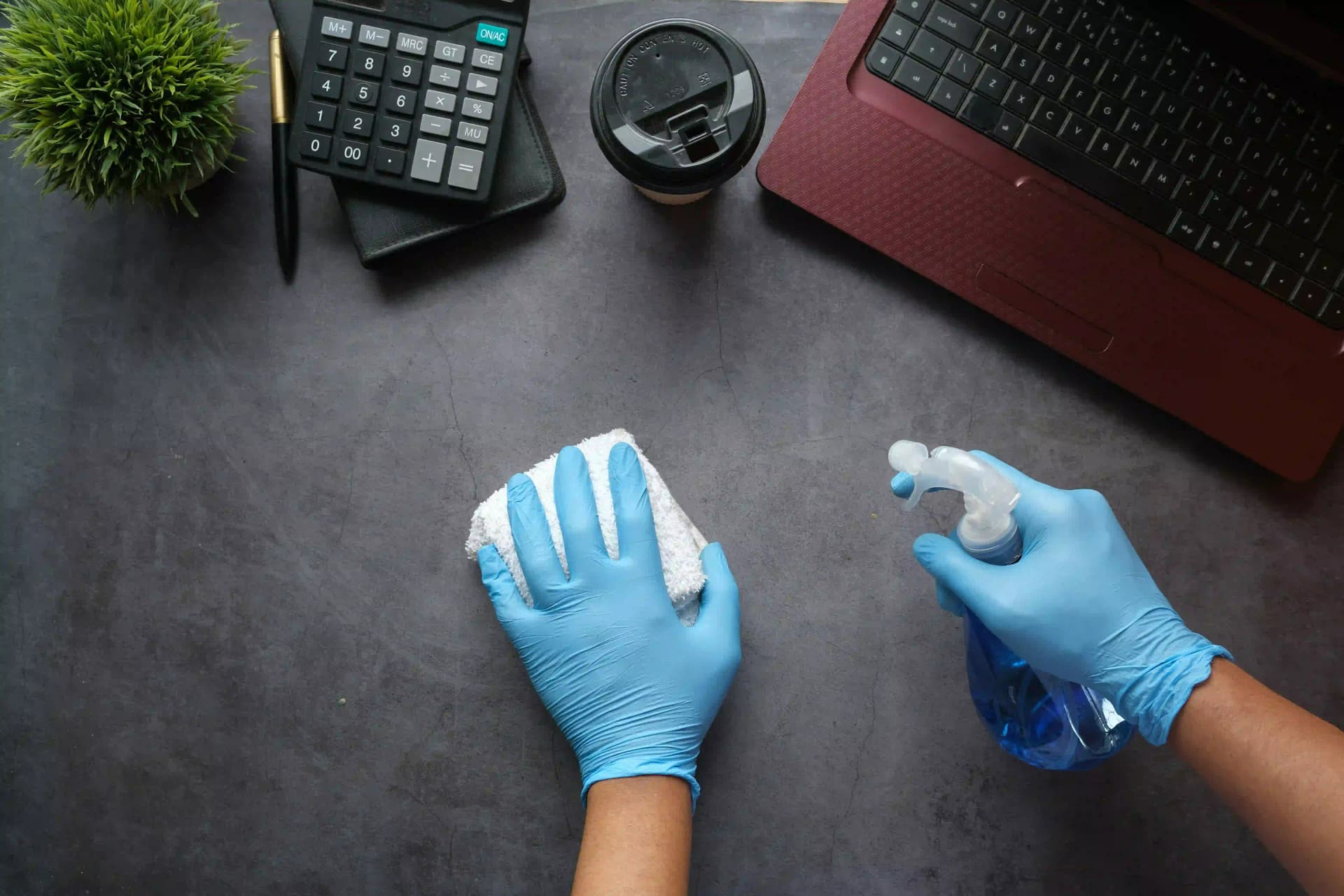Professional cleaning and disinfection of office desks and high-touch surfaces