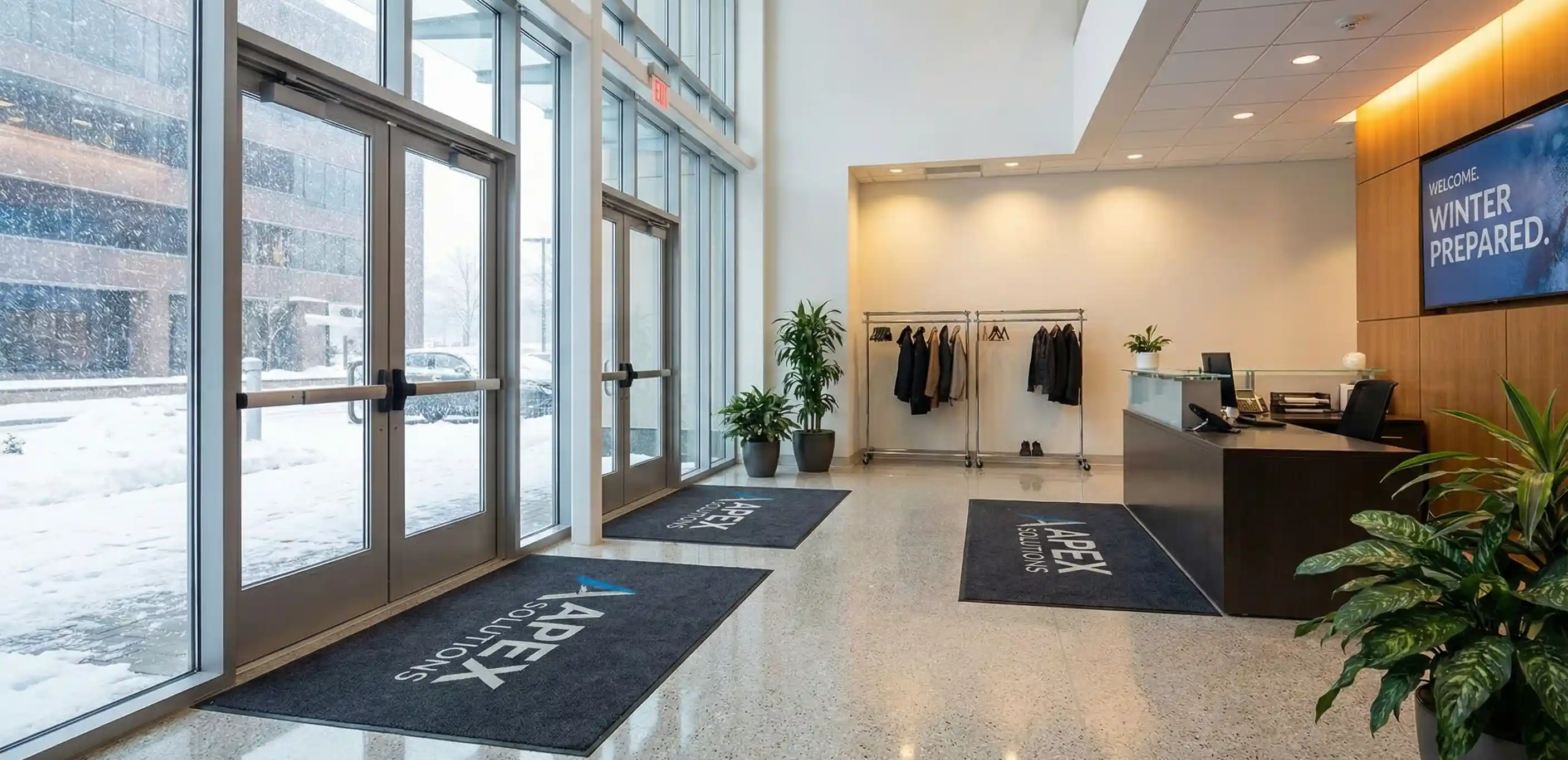 Clean Boston office entryway during winter with professional floor mats and spotless lobby