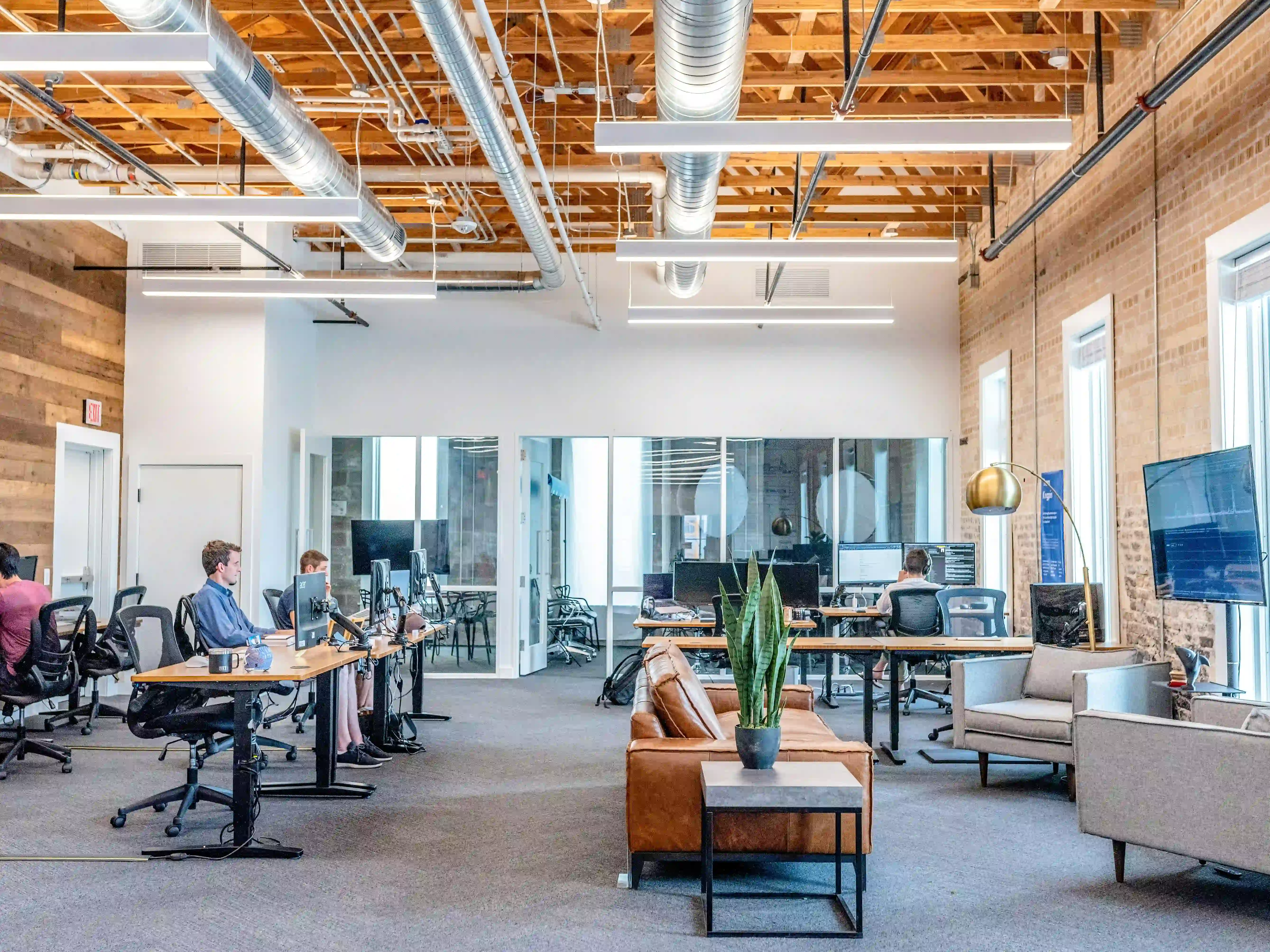 Clean and organized Boston office workspace with employees working productively